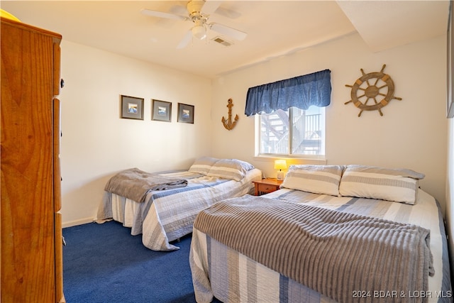 carpeted bedroom with ceiling fan