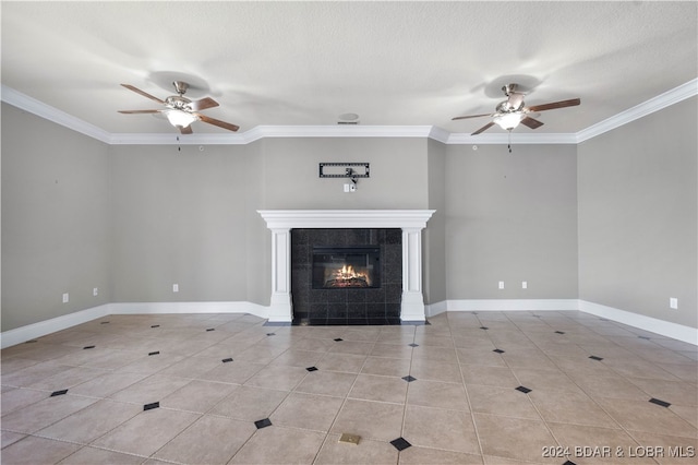 unfurnished living room featuring a textured ceiling, ceiling fan, a fireplace, and crown molding