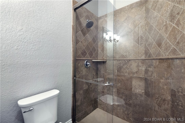 bathroom with walk in shower and toilet