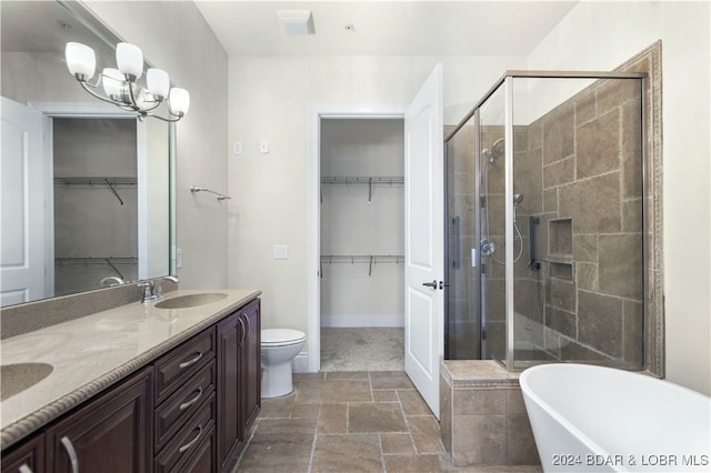 full bathroom featuring independent shower and bath, vanity, and toilet