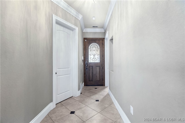 doorway featuring light tile patterned flooring and crown molding