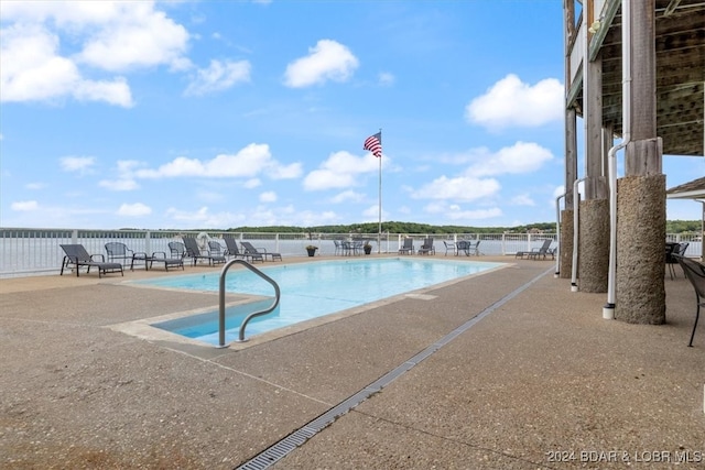 view of swimming pool featuring a patio area