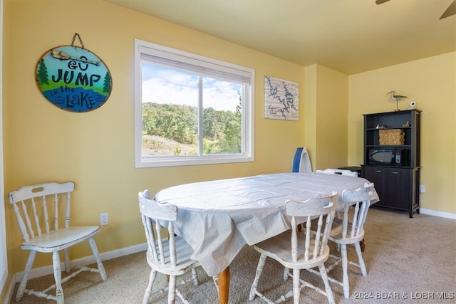 view of carpeted dining area