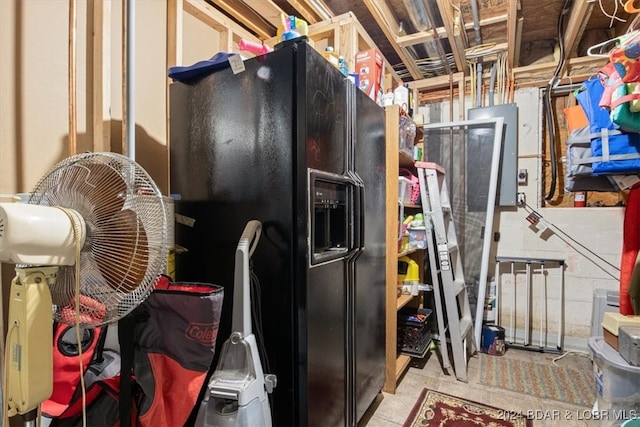 interior space featuring black refrigerator with ice dispenser