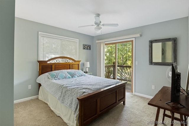 carpeted bedroom with ceiling fan and access to exterior