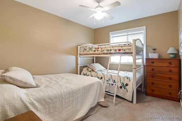 bedroom featuring ceiling fan and light colored carpet