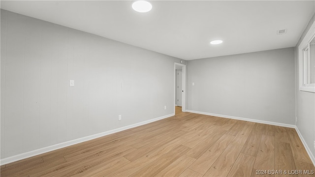 unfurnished room featuring light hardwood / wood-style floors