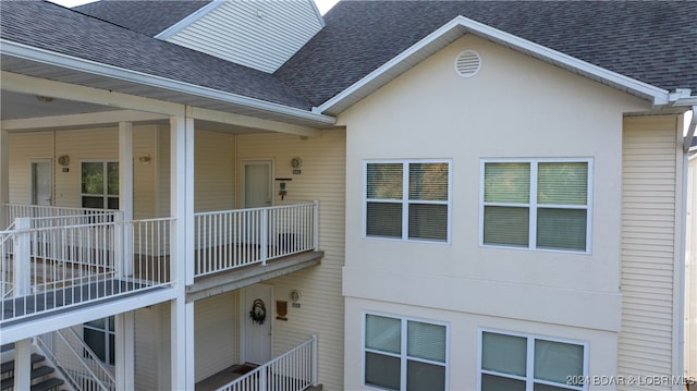 view of home's exterior with a balcony