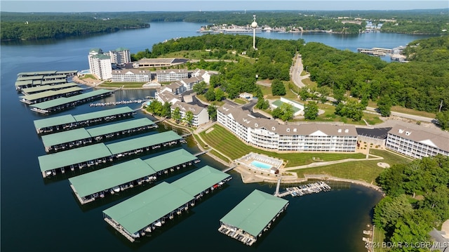 birds eye view of property with a water view