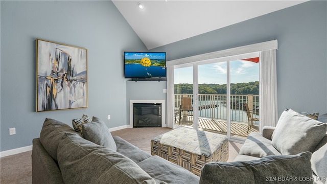 living room with carpet floors and high vaulted ceiling