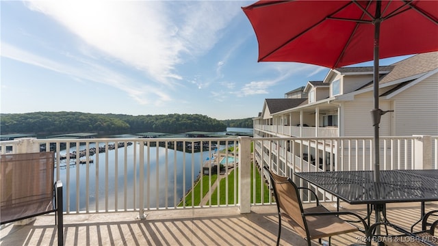 balcony featuring a water view