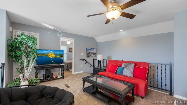 carpeted living room with lofted ceiling and ceiling fan