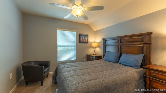 bedroom with ceiling fan, light colored carpet, and lofted ceiling