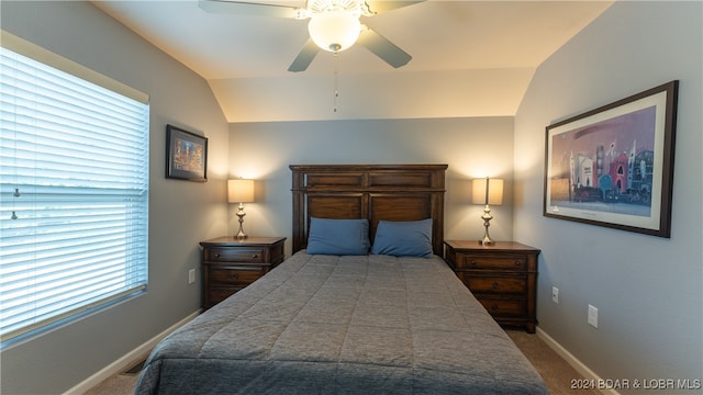 bedroom featuring carpet, lofted ceiling, and ceiling fan