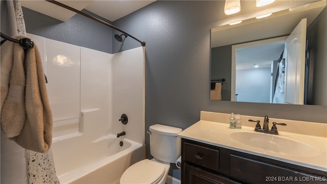 full bathroom featuring vanity, shower / bath combo with shower curtain, and toilet