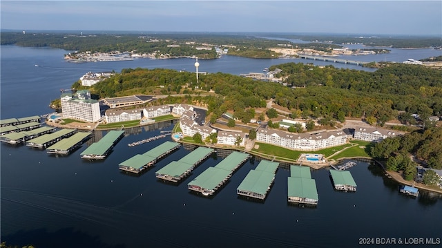 birds eye view of property with a water view