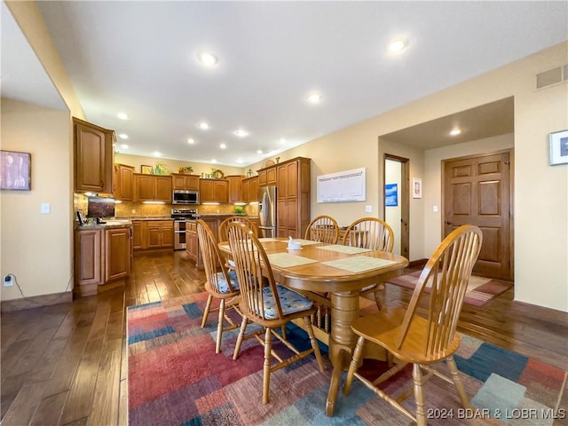 dining room featuring dark hardwood / wood-style flooring