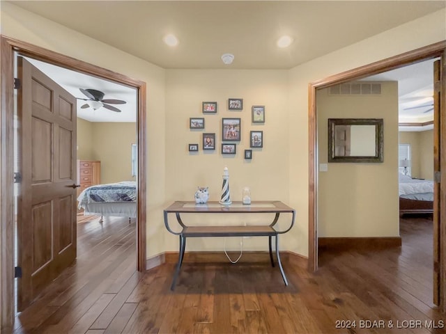 hallway featuring dark hardwood / wood-style floors