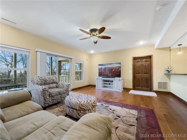 living room with ceiling fan and hardwood / wood-style floors