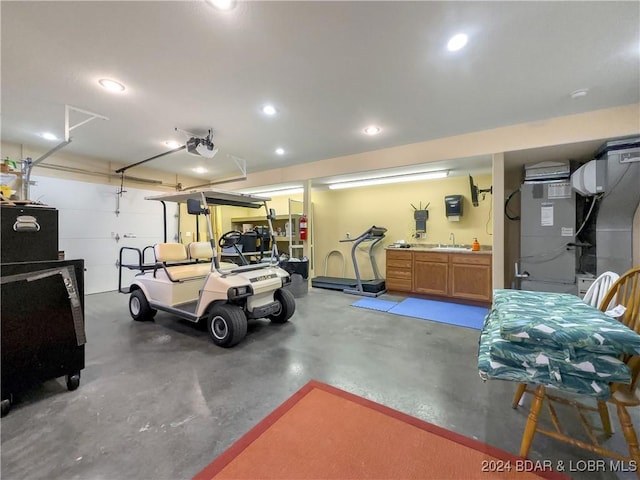 garage featuring a garage door opener and sink