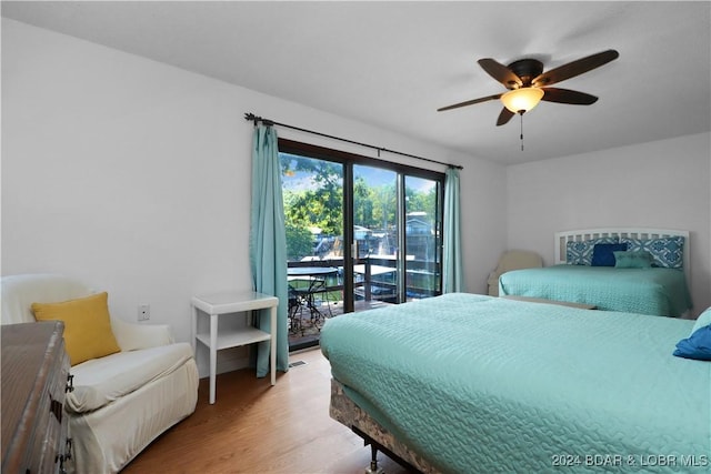 bedroom with access to exterior, ceiling fan, and hardwood / wood-style flooring