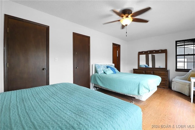 bedroom featuring light hardwood / wood-style flooring and ceiling fan