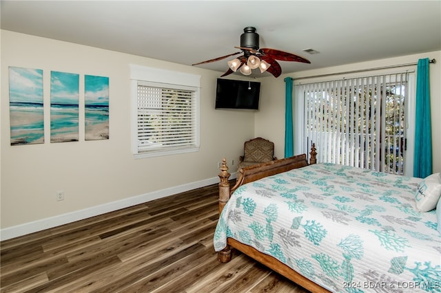 bedroom with ceiling fan, access to exterior, and dark wood-type flooring