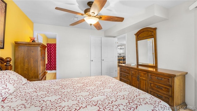 bedroom with ceiling fan and a closet