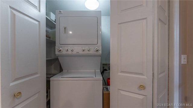 laundry area featuring stacked washing maching and dryer