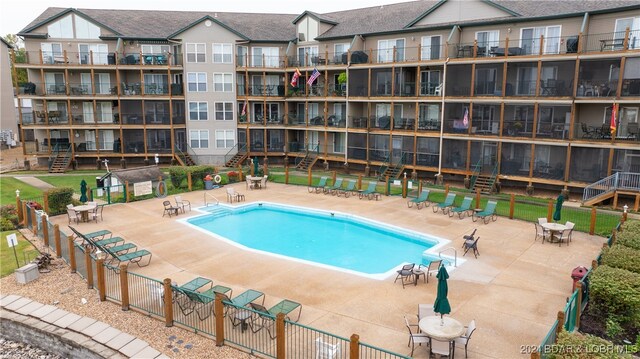 view of swimming pool featuring a patio area