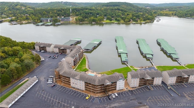 birds eye view of property with a water view