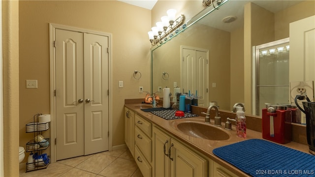 bathroom with tile patterned floors, vanity, and toilet