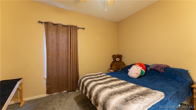 bedroom with ceiling fan and carpet flooring