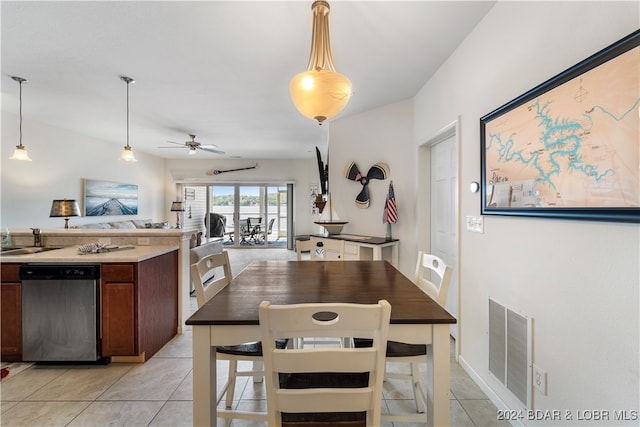 interior space featuring ceiling fan, dark brown cabinetry, hanging light fixtures, light tile patterned floors, and stainless steel dishwasher