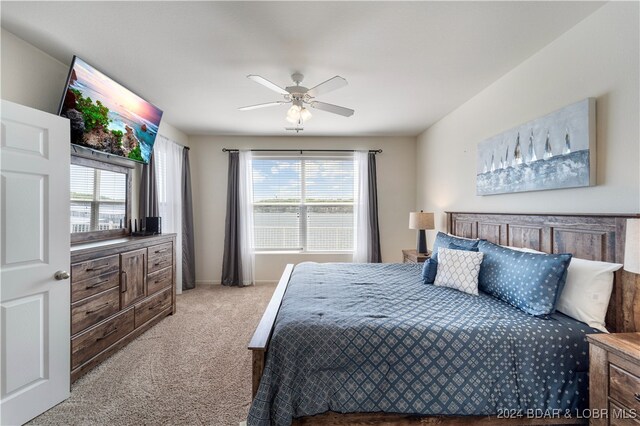 carpeted bedroom featuring ceiling fan