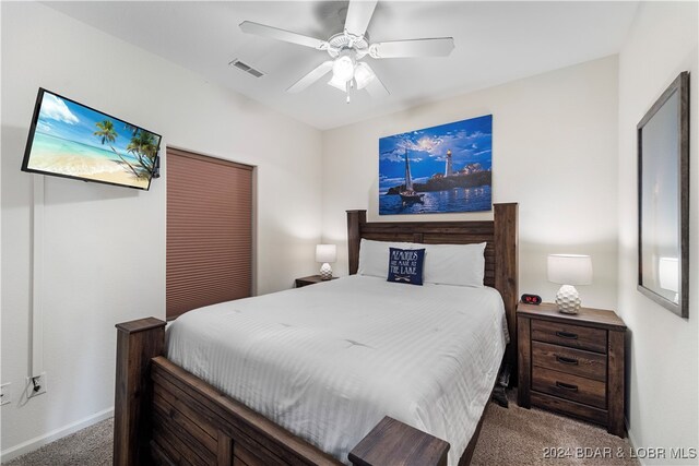 bedroom with ceiling fan and carpet