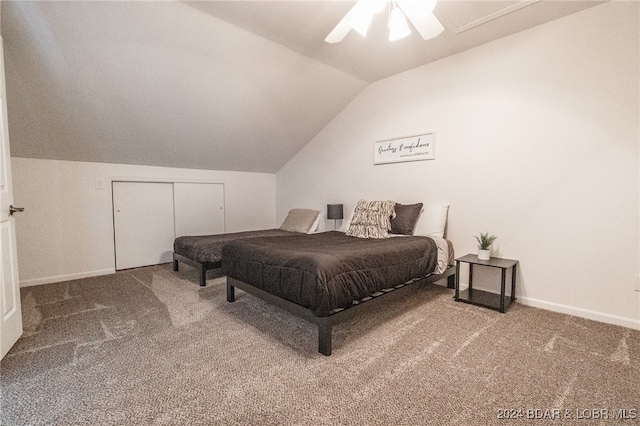 carpeted bedroom featuring ceiling fan, lofted ceiling, and a closet