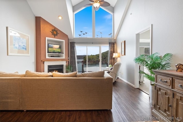 living room with high vaulted ceiling, ceiling fan, beamed ceiling, and dark hardwood / wood-style flooring