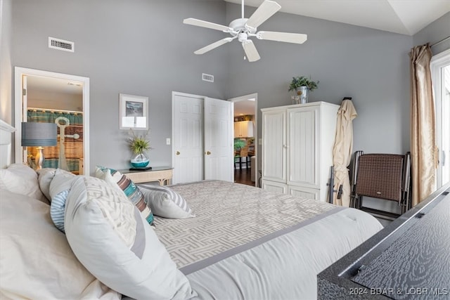 bedroom with high vaulted ceiling, wood-type flooring, ceiling fan, and multiple windows