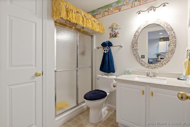 bathroom featuring walk in shower, vanity, and toilet