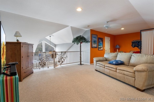 carpeted living room featuring ceiling fan and lofted ceiling