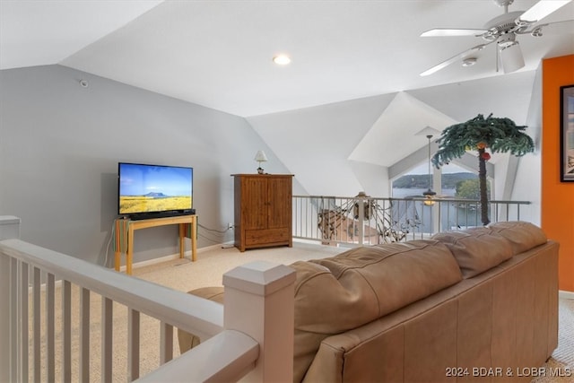 carpeted living room featuring vaulted ceiling and ceiling fan