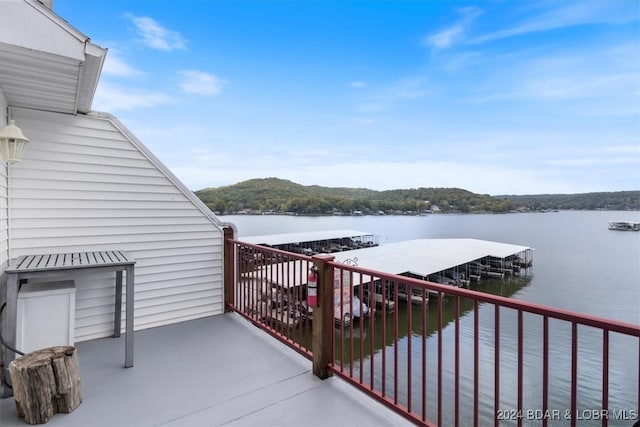 balcony featuring a water view