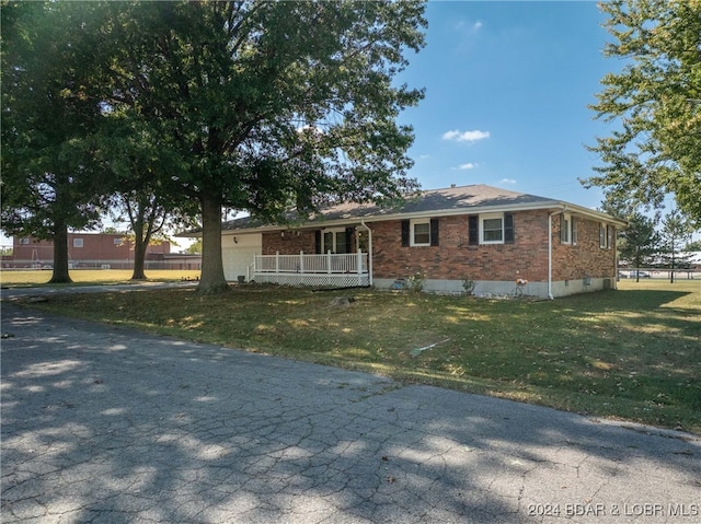 ranch-style house with a front lawn