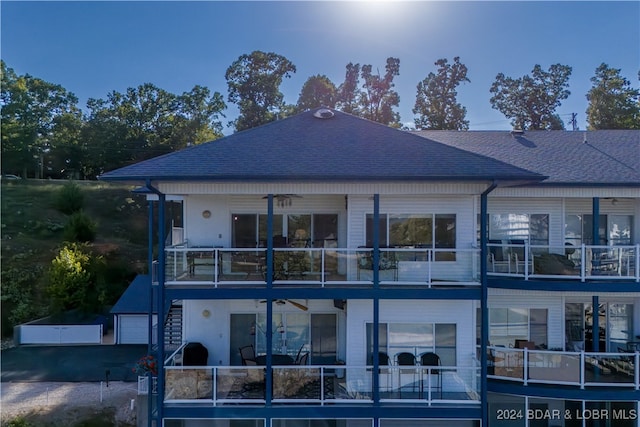 back of house with a balcony