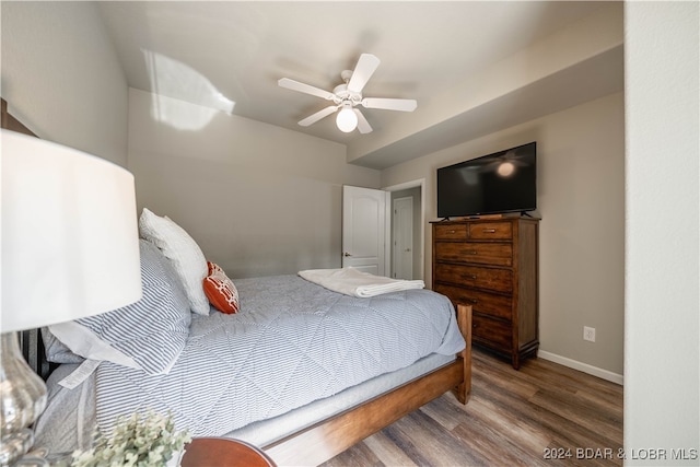 bedroom with ceiling fan and hardwood / wood-style floors