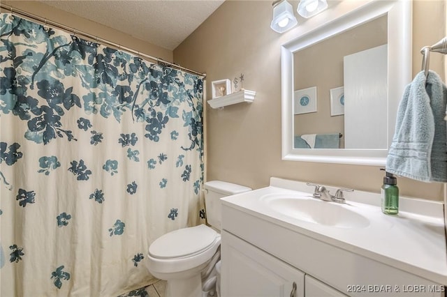 bathroom featuring vanity, a shower with shower curtain, a textured ceiling, and toilet