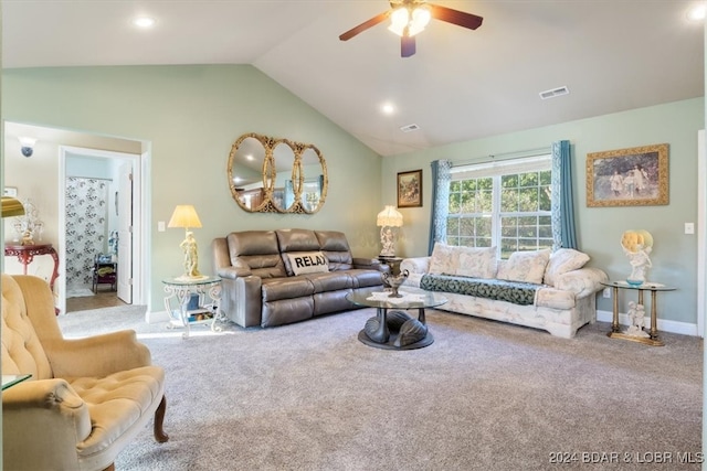 carpeted living room featuring vaulted ceiling and ceiling fan