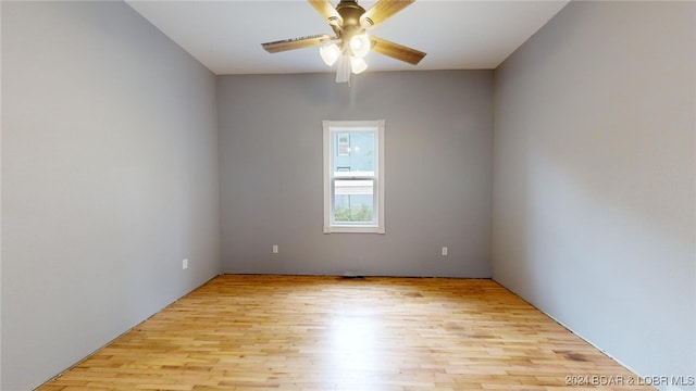 spare room featuring ceiling fan and light wood-type flooring