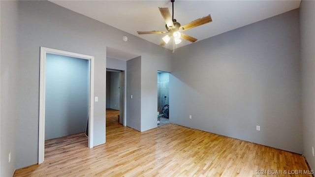 unfurnished bedroom with a closet, ceiling fan, and light hardwood / wood-style flooring